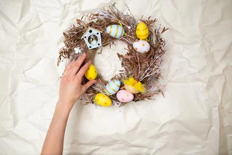 Easter wreath hand made. Colored Eggs and Chickens Home Decoration Glue Gun DIY Stock Photos
