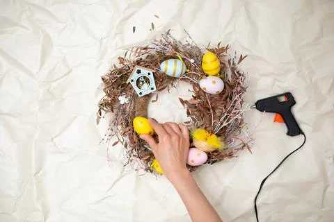 Easter wreath hand made. Colored Eggs and Chickens Home Decoration Glue Gun DIY Stock Photos