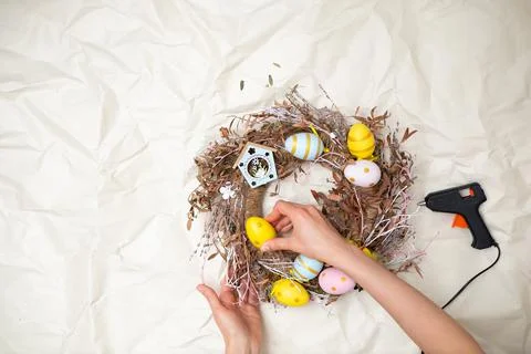 Easter wreath hand made. Colored Eggs and Chickens Home Decoration Glue Gun DIY Stock Photos