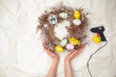Easter wreath hand made. Colored Eggs and Chickens Home Decoration Glue Gun DIY Stock Photos