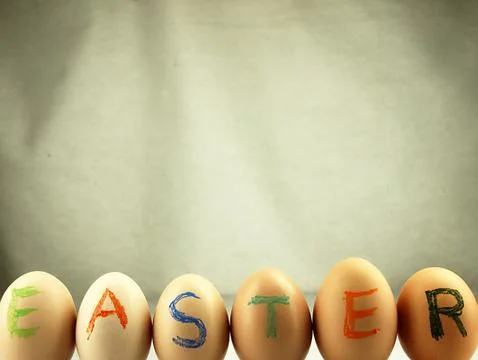 Easter written on eggs. Stock Photos
