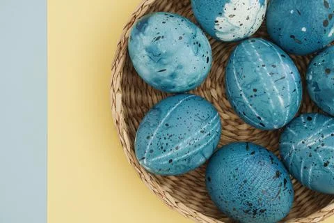 Easter yellow-blue background with creative stylish painted Easter eggs Stock Photos
