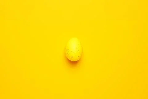 Easter yellow egg on yellow background. Flat lay, copy space beautiful Stock Photos