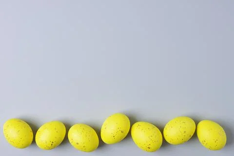 Easter yellow eggs on grey background. Flat lay, copy space. beautiful Stock Photos