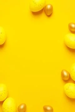Easter yellow eggs on a yellow background. Flat lay, copy space. beautiful Stock Photos