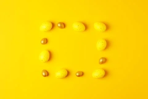 Easter yellow eggs on a yellow background. Flat lay, copy space. beautiful Stock Photos
