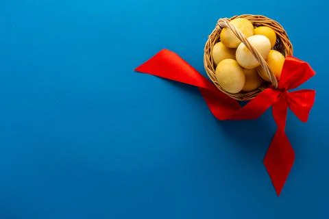 Easter yellow painted eggs on blue background Stock Photos