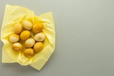 Easter yellow painted eggs on gray background Stock Photos