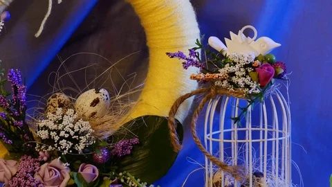Easter Yellow Ring With Spring Flowers Covering It, a Top Egg Cage With a White Stock Footage 72887094