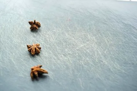 Eastern condiments scattered on a table at home. Turmeric and pe Stock Photos