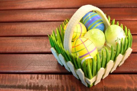 Eastern eggs and basket Stock Photos