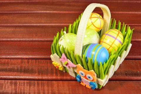 Eastern eggs and basket Stock Photos