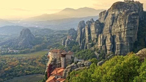 Eastern Orthodox monasteries complex, rocks and a valley in Meteora, Greece. 4K Stock Footage 98603117