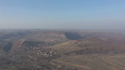 Eastern Serbian landscape with small settlement 4K drone footage Stock Footage 99776864