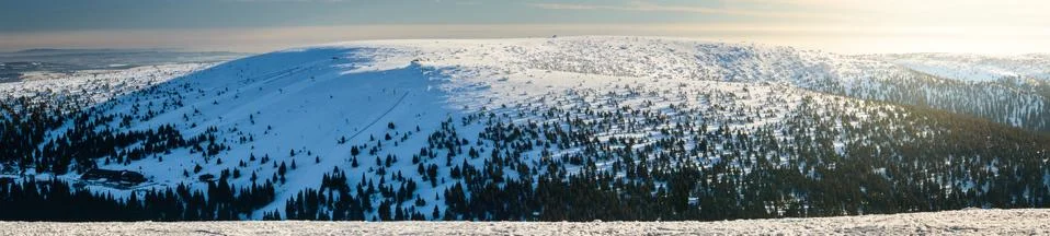Eastern Sudetes, panorama on snow-capped mountain peaks. Stock Photos
