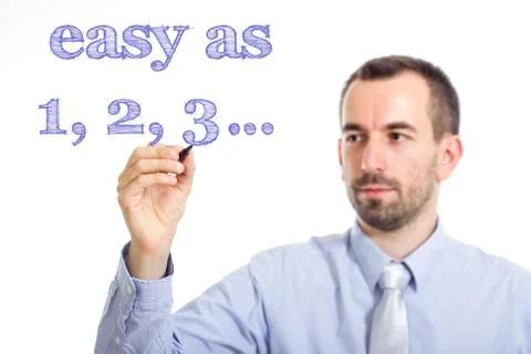 Easy as 1, 2, 3 - Young businessman writing blue text on transparent surface Stock Photos