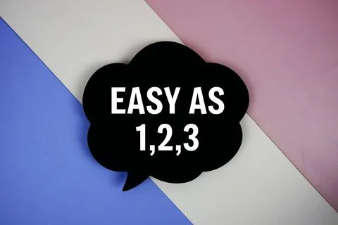 EASY AS 1,2,3 text on speech bubble top view on purple geometric background Stock Photos