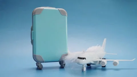 Easy and comfortable flight, airplane and feather on a blue background Stock Footage 250386569
