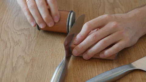 Easy and quick flipping of a knife on a magnetic sharpening system holder Stock Footage 315209476