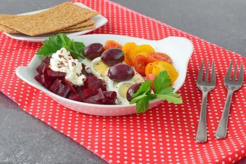 Easy breakfast : beetroots, cherry tomato, egg, cottage cheese and crisps. Stock Photos