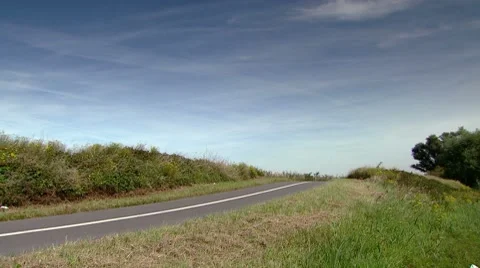 Easy going cyclist. Going up a small hill. Stock Footage 8686847