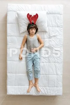 Easy goofy kid wearing unusual hat Stock Photos