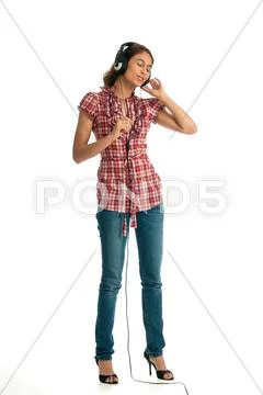 Easy listening to her music on headphones Stock Photos