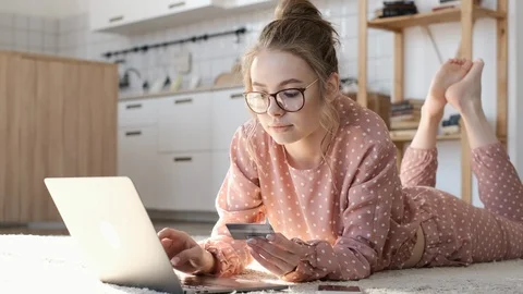 Easy pay using digital gadget. Girl using laptop at home. Stock Footage 104791252