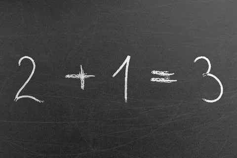 Easy school math equation 2 plus 1 is 3 written on a chalkboard by a student Stock Photos