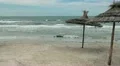 Easy storm the Mediterranean Sea and palm-leaf parasols HD Footage