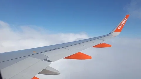 EasyJet above the clouds. 4K Stock Footage 107343714