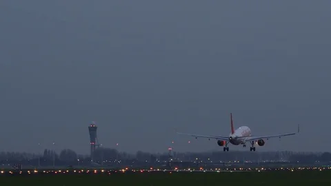 Easyjet airplane arriving at night at ai... | Stock Video | Pond5