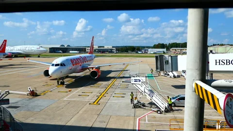 EasyJet plane being prepared to be unloaded at London Gatwick Airport Stock Footage 244739751