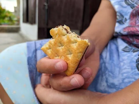 Eat biscuits Stock Photos