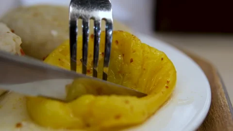 Eat with a fork cut with a knife baked peppers grilled yellow pepper Stock Footage 291938209