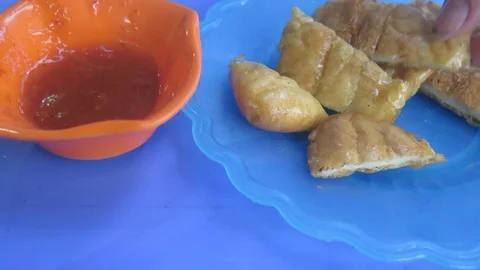 Eat fried squid with chilli sauce Stock Footage 70538767