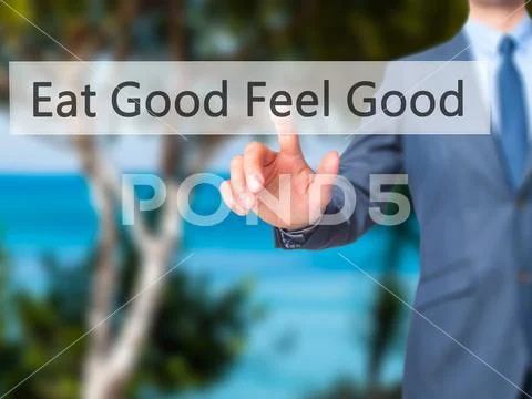 Eat Good Feel Good - Businessman press on digital screen. Stock Photos