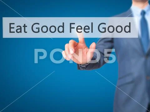 Eat Good Feel Good - Businessman press on digital screen. Stock Photos