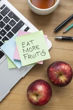 Eat More Fruit Sticky Note on Laptop  Healthy Lifestyle Motivation Stock Photos
