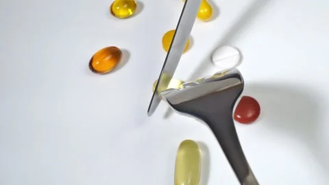 Eat pills with fork and knife Video stock 272147242