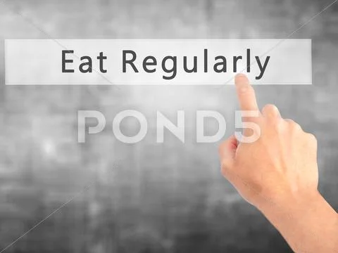 Eat Regularly - Hand Pressing A Button On Blurred Background Concept . Busine