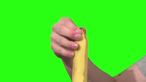Eating a banana, green background Stock Footage 49862425
