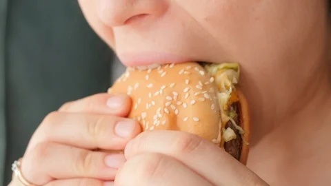 Eating, biting burger close, macro Stock Footage 126027224
