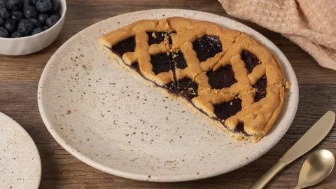 Eating blueberry pie slice by slice, stop motion animation. Stock Footage 340524590