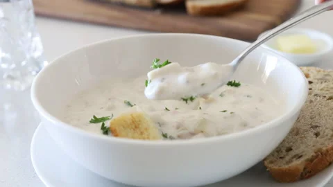 Eating a Bowl of Clam Chowder Stock Footage 149997649