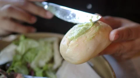 Eating bread with guacamole and salad Stock Footage 341456035