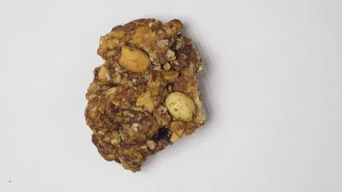Eating brown cookie. Stop motion Stock Footage 129958050