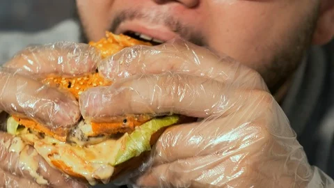 Eating a burger in a cafe Stockbeeldmateriaal 119267058