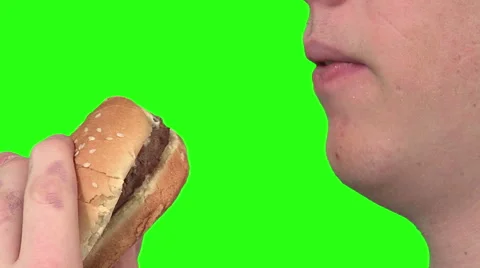 Eating a burger, green background Video stock 49862434