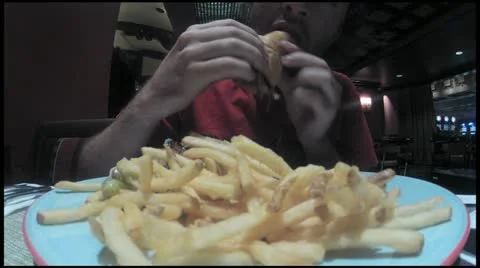 Eating burger - HD Stock Footage 12225431